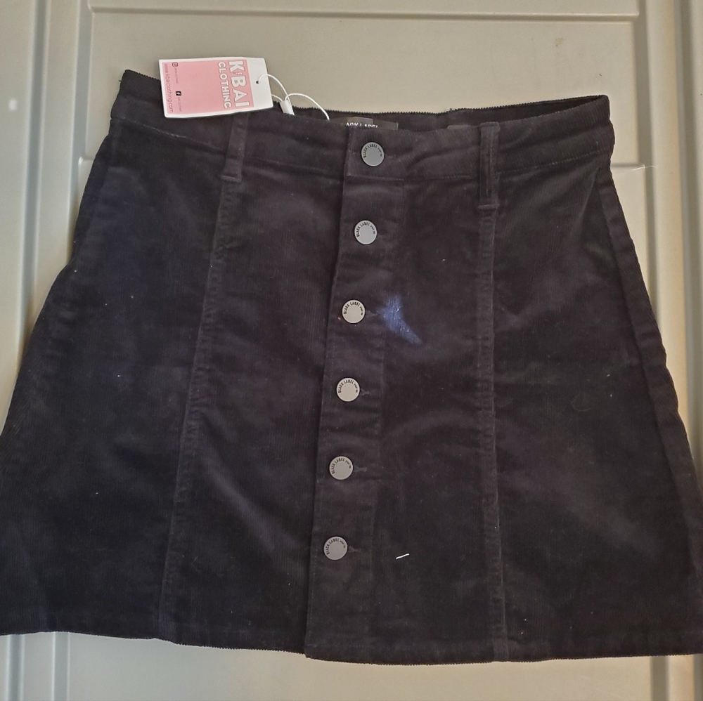Black corduroy button up mini skirt. Boutique.  Never worn. NWT. Size small